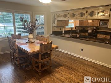 Germantown house for rent - A kitchen with a wooden table and chairs.