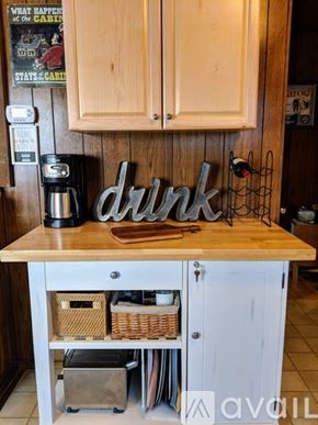 Truckee house for rent - A kitchen counter with a coffee maker and a sign that says "drink".