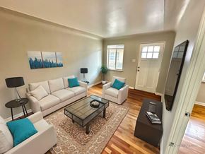Lakewood apartment for rent - A room with wooden walls and a white door.