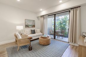 Cape Coral apartment for rent - A living room with a couch, chair, and table.