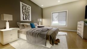 Marinette apartment for rent - A bedroom with a bed, nightstands, and a motivational poster on the wall.