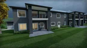 Marinette apartment for rent - A modern apartment complex with a grassy front yard.