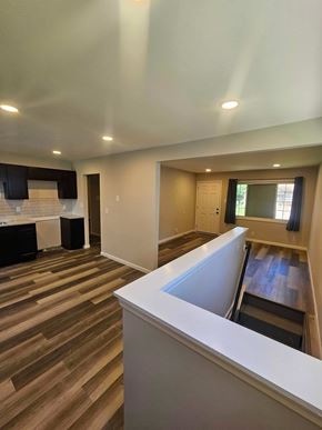 St Louis house for rent - A room with a white counter and wooden floors.