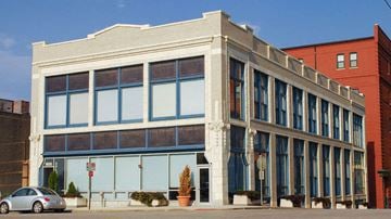 Kansas City apartment for rent - a white building with a car parked in front of it