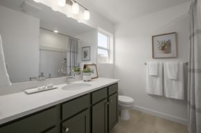 Salt Lake City townhouse for rent - A bathroom with a white countertop and green cabinets.