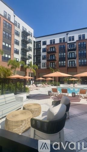 Tampa apartment for rent - A living room with a white sofa and a painting on the wall.