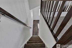 Barstow apartment for rent - A staircase with a carpeted runner and wooden balusters.