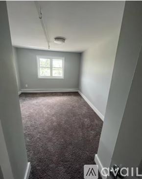 Keansburg apartment for rent - A room with a carpeted floor and a window.