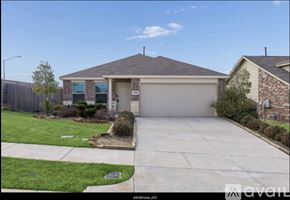 Fort Worth house for rent - A house with a garage and a driveway in front.