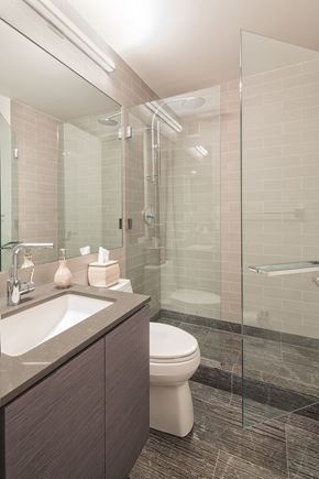New York apartment for rent - a bathroom with a toilet sink and shower