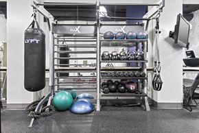 Seattle apartment for rent - A gym with a punching bag, kettlebells, and weightlifting equipment.