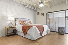 Richmond apartment for rent - a bedroom with a bed and a ceiling fan