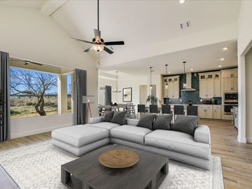 Horseshoe Bay house for rent - A modern living room with a large sectional sofa and a coffee table in the center.