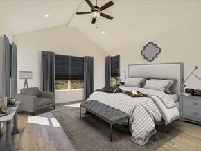Horseshoe Bay house for rent - A bedroom with a large bed, a ceiling fan, and a window with curtains.
