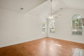Glen Allen house for rent - A room with a ceiling fan and two windows.
