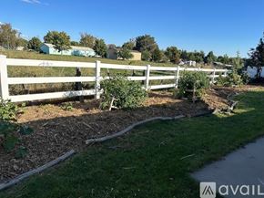 Weiser house for rent - A white fence runs along the edge of a grassy area.