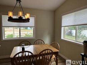 Weiser house for rent - A dining room with a wooden table and chairs.