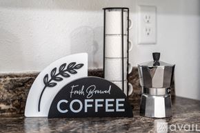 Kissimmee townhouse for rent - A coffee maker with a sign that says "Fresh Brewed COFFEE" is on a countertop.