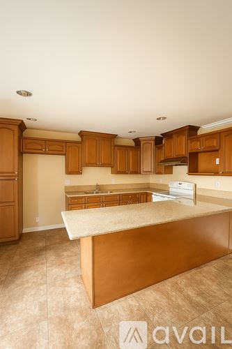 Buena Park apartment for rent - A kitchen with wooden cabinets and a marble countertop is available for rent.