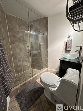 Miami Beach apartment for rent - A bedroom with a large bed and a smaller bed in the corner.