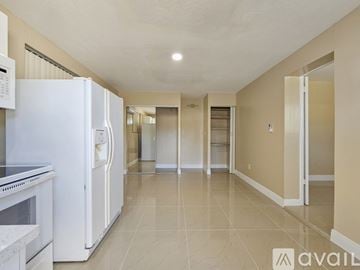 Miramar apartment for rent - A kitchen with a white refrigerator and a white oven.
