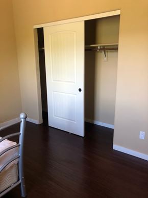 Flagstaff house for rent - A white door is open to a hallway.