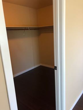 Flagstaff house for rent - A small, empty closet with a white door.