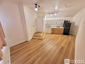 Escondido house for rent - A room with wooden flooring and a ceiling fan.