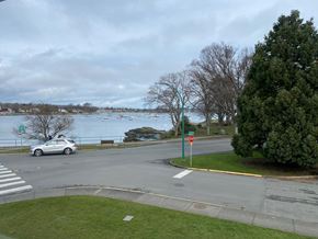 Victoria apartment for rent - A car is stopped at a stop sign at a four-way intersection.