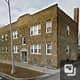 Chicago apartment for rent - A brown building with a white door and windows.