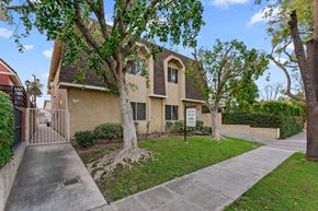 Burbank apartment for rent - A house with a tree in front of it.