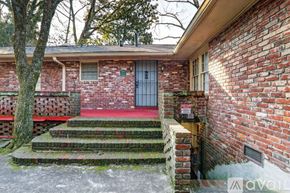 Atlanta apartment for rent - A living room with a fireplace and a zebra print pillow.
