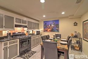 Atlanta apartment for rent - A kitchen with a dining table set for four.