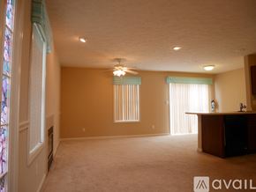 Bloomington condo for rent - A dining room with a wooden table and chairs.
