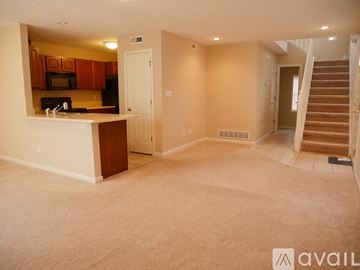 Bloomington condo for rent - A kitchen with a table and chairs in the foreground.