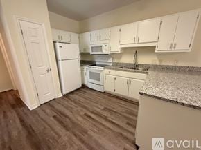 Santa Rosa Beach apartment for rent - A bathroom with a toilet, sink and mirror.