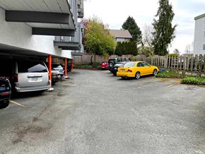 Victoria apartment for rent - A yellow car is parked in a parking lot.