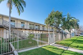 Toluca Lake apartment for rent - A sunny day at a residential complex with a clear blue sky.