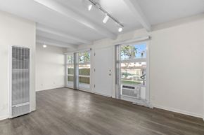 Toluca Lake apartment for rent - A room with a white wall and a window with blinds.