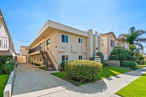 Burbank apartment for rent - A house numbered 530 with a driveway and a green bush in front.