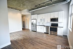 Chicago apartment for rent - A kitchen with white cabinets and stainless steel appliances.