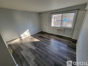 La Crosse apartment for rent - A room with a window and a door is available for rent.