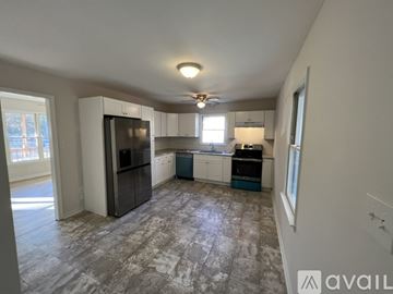 Richmond house for rent - A kitchen with a refrigerator, stove, and oven.