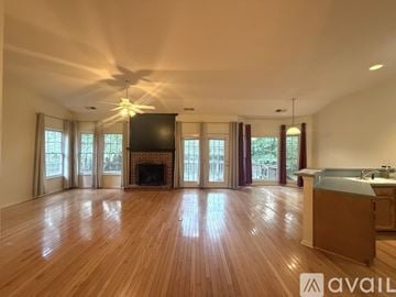 Rock Hill house for rent - A kitchen with wooden cabinets and a white refrigerator.