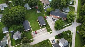 Millbury apartment for rent - A residential area with houses and cars.