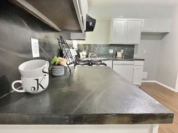 Oklahoma City house for rent - A kitchen counter with a white mug that has the letter K on it.