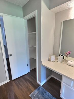 Oklahoma City house for rent - A bathroom with a white vanity and a white door.