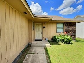 Oklahoma City house for rent - A house with a white door and a small porch.