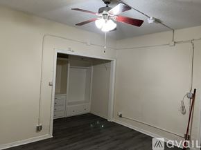 Los Angeles apartment for rent - A room with a ceiling fan and a doorway leading to another room.
