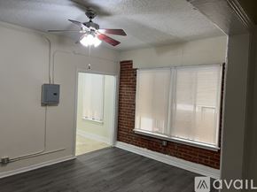 Los Angeles apartment for rent - A room with a ceiling fan and a window with blinds.